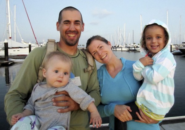 Eric and Charlotte Kaufman with their daughters, Lyra, 1, and Cora, 3.   (AP Photo/Sariah English. File)