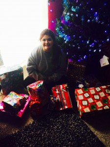 Analycea Miranda sits next to a pile of presents she helped collect for 37 needy children in Sonoma County. (photo provided by family)